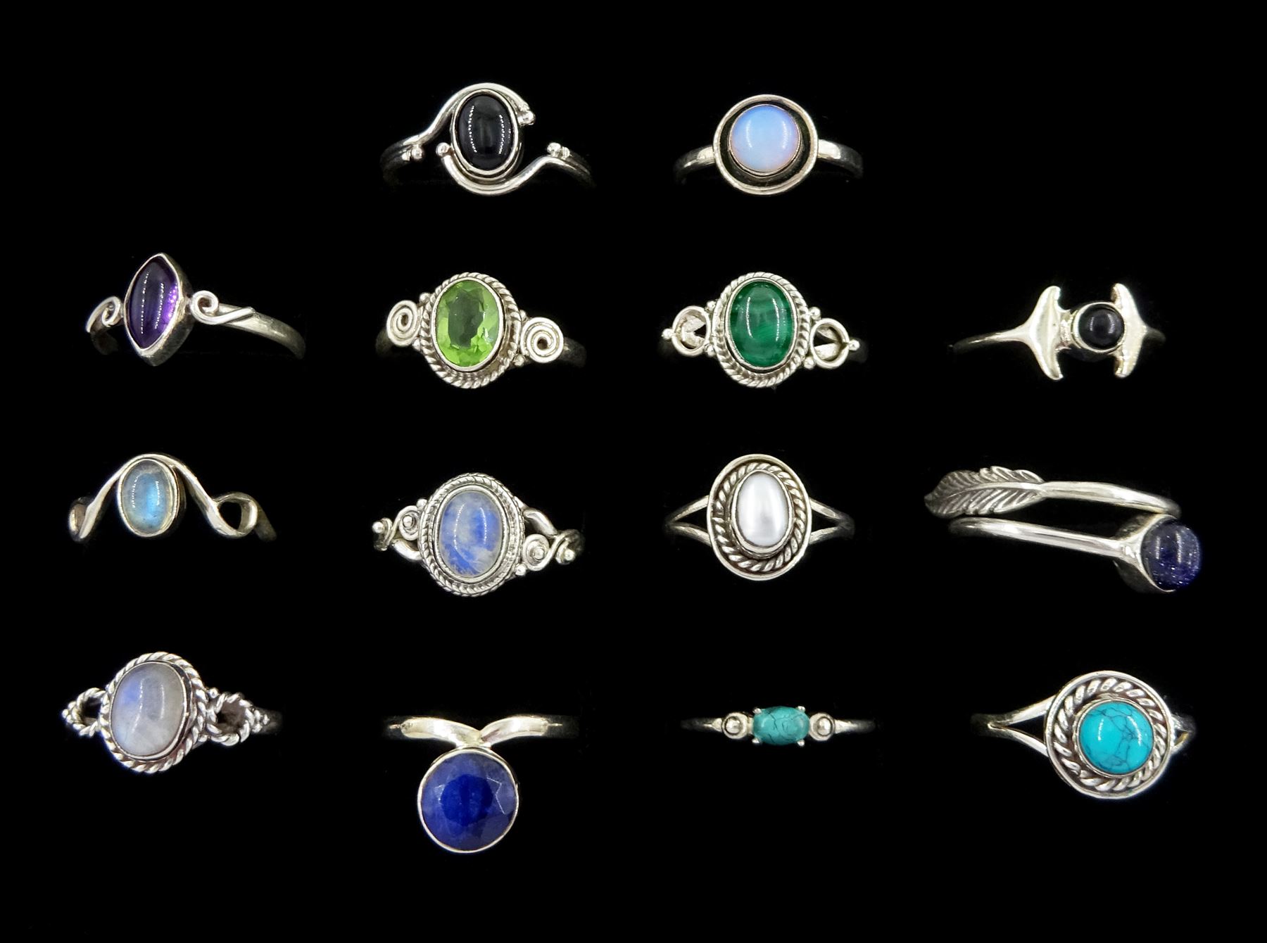 Fourteen silver stone set rings malachite, turquoise, moonstone, peridot, pearl and amethyst