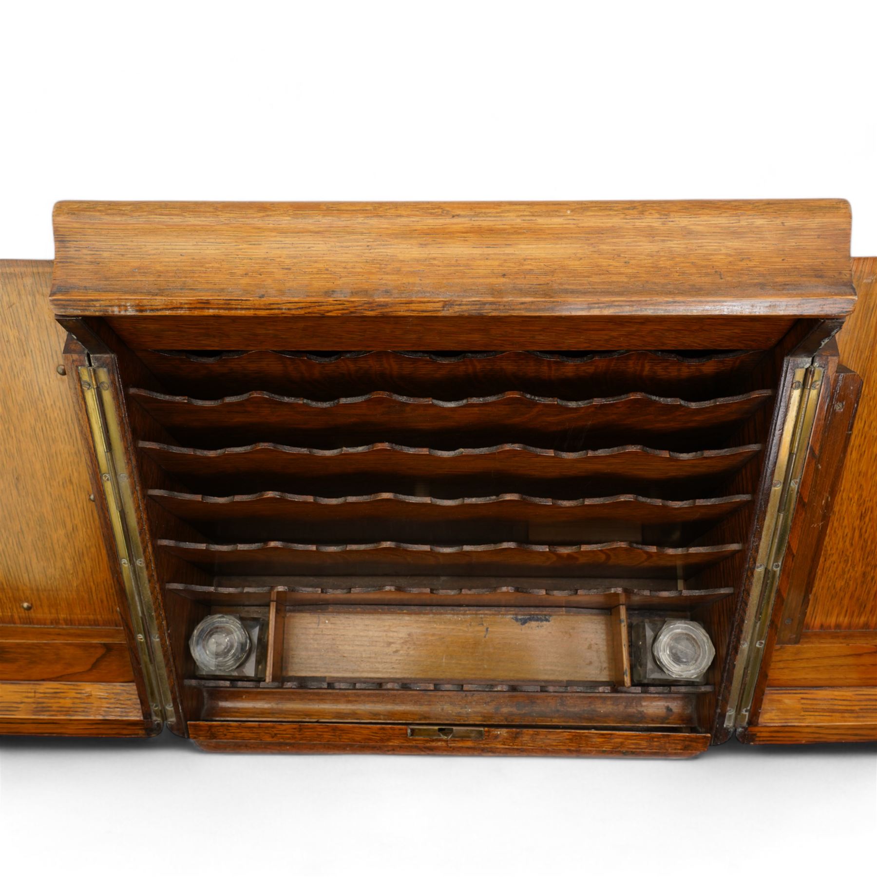 Edwardian oak correspondence box, the hinged sloping front enclosing a fitted interior incorporating a stationery rack, perpetual calendar, pen tray and two glass inkwells, H32cm x W40cm