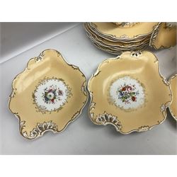 Victorian part dessert service, including eighteen plates, four small serving dishes, shallow dish, etc hand painted with floral sprigs within a cream border with floral panels, and heightened in gilt (26cm)