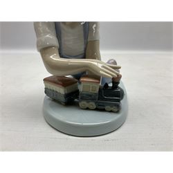Three Lladro figures, comprising All Aboard no 7619, Taking Time no 5988 and Little Leaguer no 5291, all with original boxes, largest example H19cm