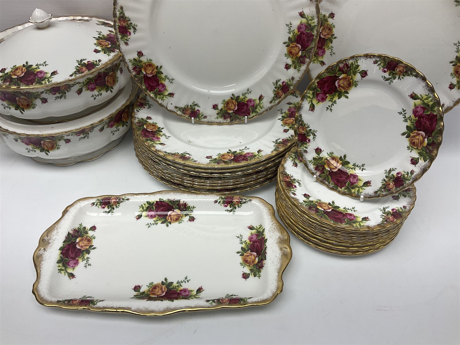 Royal Albert Old Country Roses pattern part tea and dinner service, to include two tureens, eight dinner plates, six side plates, twelve bowls, two mugs, seven teacups and saucers, milk jug,  twelve cake plates, six soup bowls and saucers, candlesticks, etc (95)