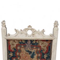 19th century carved wood fire screen, with lift-up tapestry panel, pierced pediment carved with C-scrolls and curled leaves, flanked by moulded uprights with torch finials, on scrolled out splayed feet 