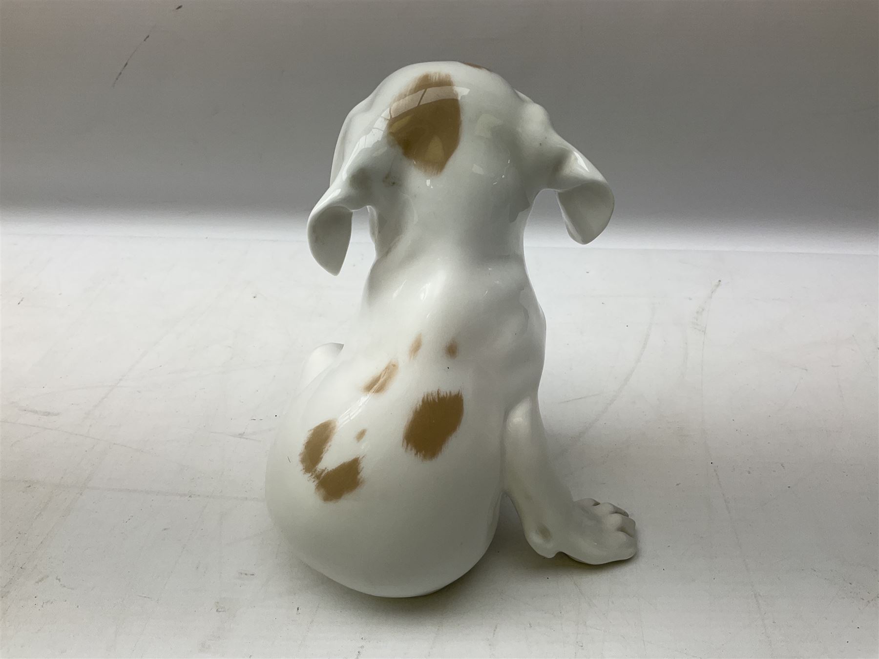 Royal Copenhagen figure of a pointer puppy, modelled seated with rare ...