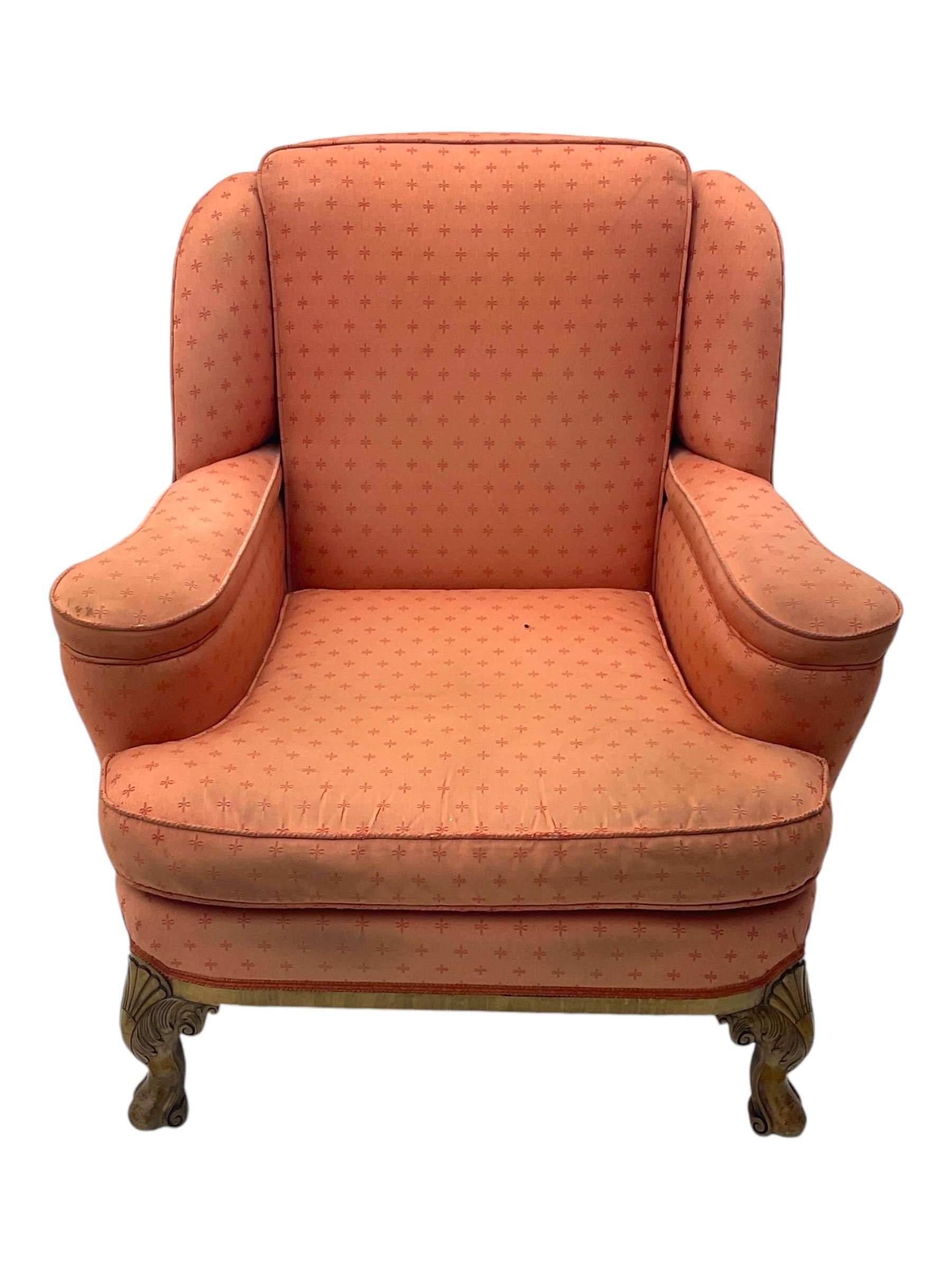 Late 20th century mahogany framed three seat sofa, upholstered in cream fabric with repeating cross pattern, raised on cabriole supports (W192cm, D98cm, H89cm); matching armchair in light pink fabric (W92cm, D98cm, H89cm) 