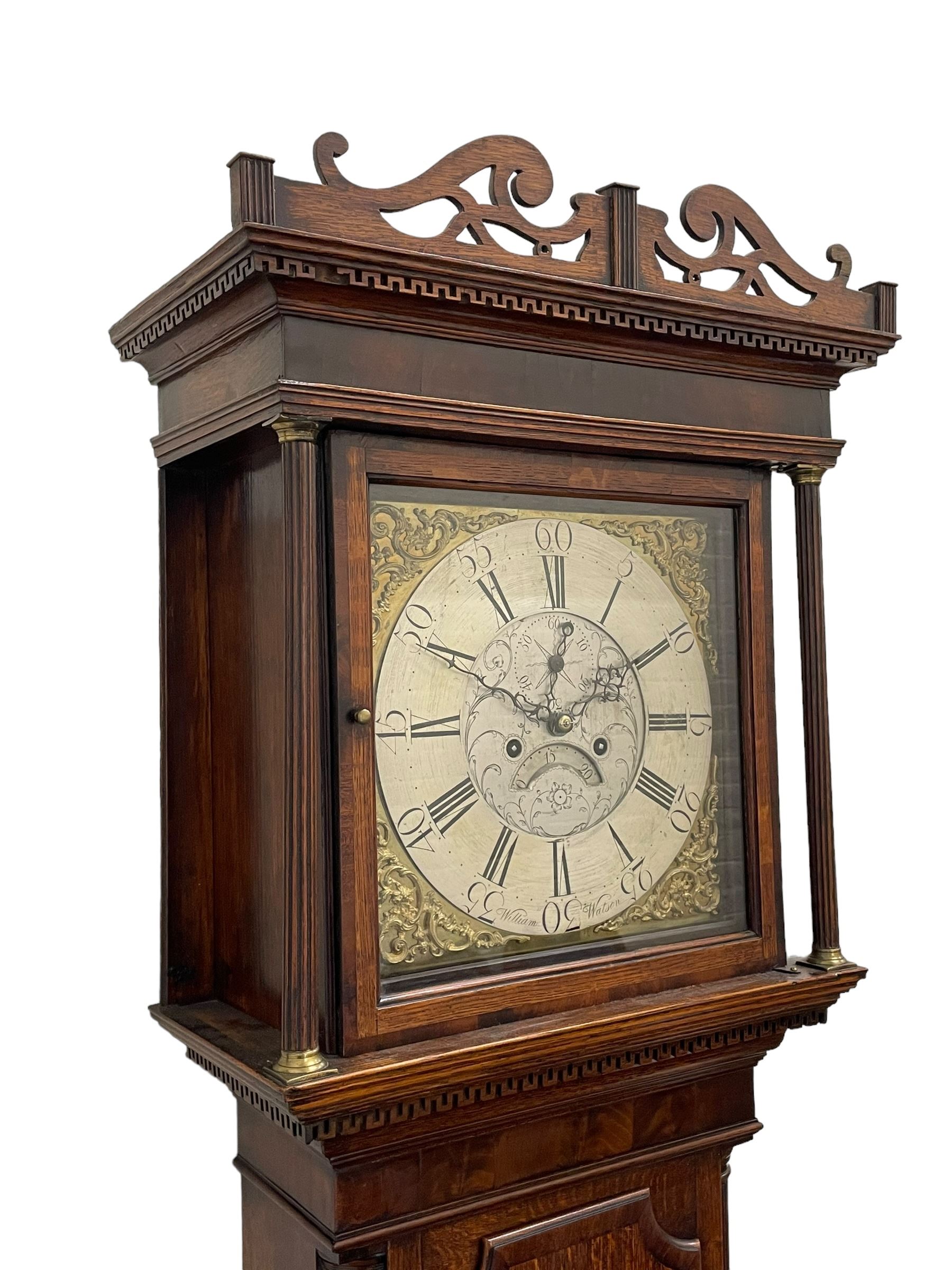 William Watson of  Blackburn (Lancs)  - late 18th century 8-day oak and mahogany cross banded longcase clock, with a flat top and open fretwork above, deep cornice with dogtooth moulding and frieze beneath, square hood door flanked by reeded pilasters with brass capitals, trunk with  reeded quarter columns, long trunk door with concave corners on a plinth with canted corners on bracket feet, brass dial with cast brass spandrels, broad silvered chapter ring with Roman numerals and five-minute Arabic's, a profusely engraved and silvered dial centre with seconds dial, matching steel hands and calendar aperture, hourly rack striking movement with a recoil anchor escapement. With weights, pendulum and key. 
William Watson of Northgate, Blackburn, is recorded as working c1770-1814 . As with this clock he frequently signed some of his clocks without a placename.