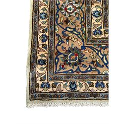 Persian Kashmar pale green ground rug, shaped central medallion decorated with stylised flower heads, the surrounding field with scrolling leafy branches and palmettes, the spandrels and border decorated with further palettes, within floral pattern guard stripes