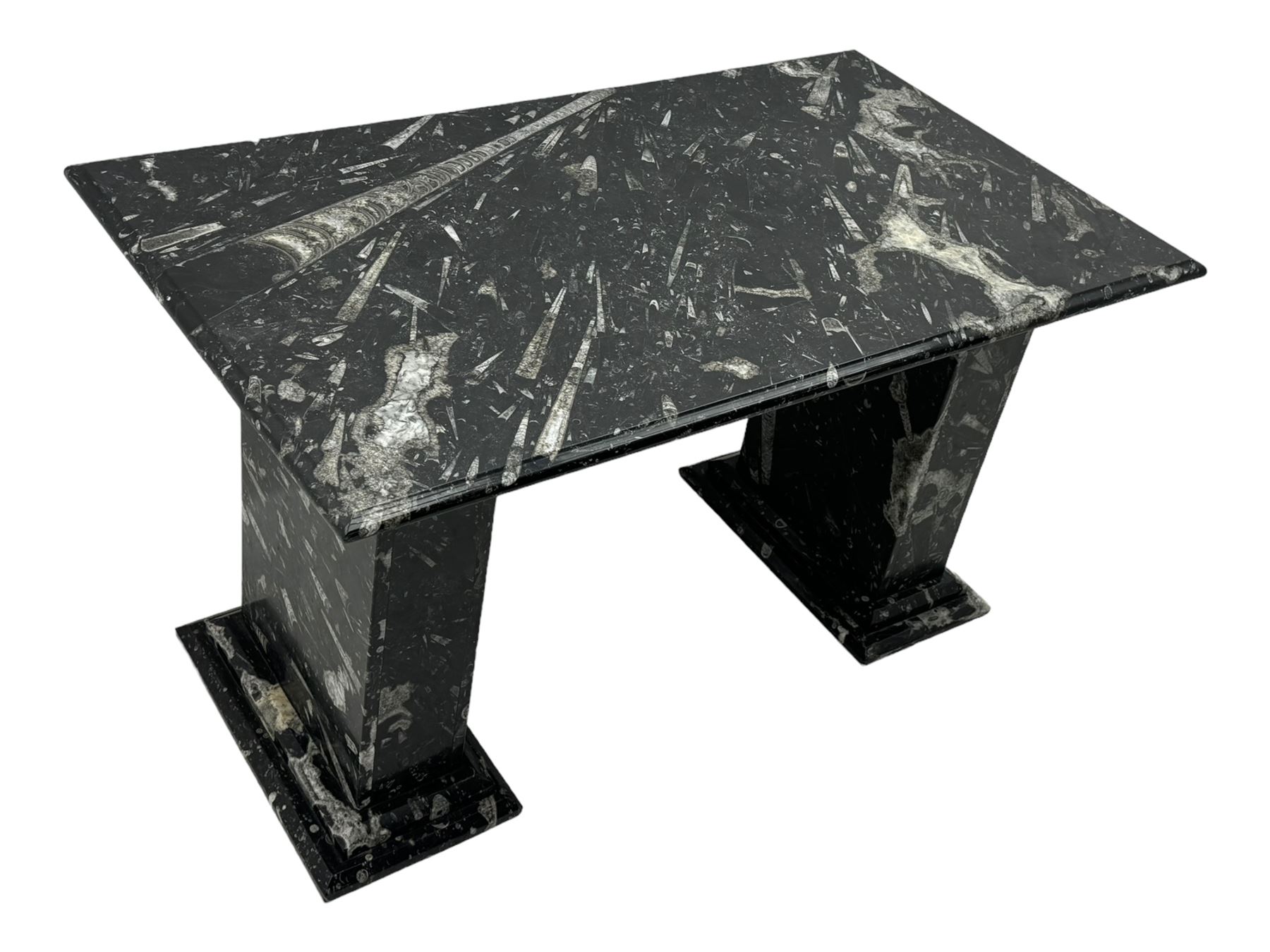 Marble hall table with orthoceras and goniatite inclusions, the rectangular top upon two rectangular stepped plinths, H78cm, L135cm, D77cm