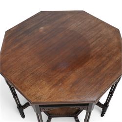 Late 19th to early 20th century mahogany octagonal centre table, moulded top over pierced arcade frieze rails and fretwork brackets, on eight cluster column supports terminating to turned feet, united by under tier with raised gallery 