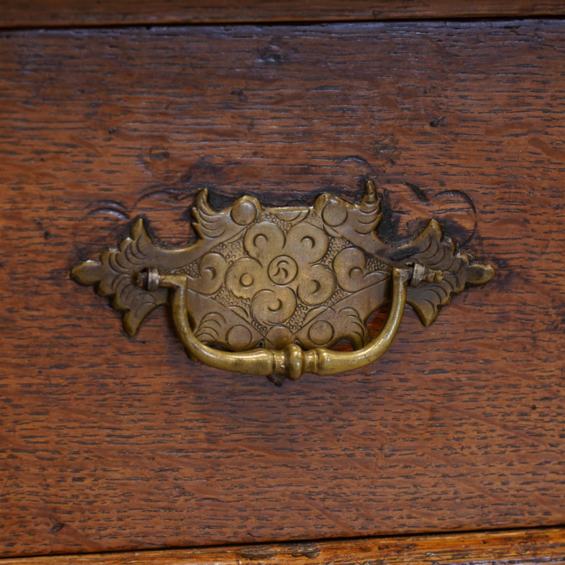 George III oak chest, moulded rectangular top over two short and three long drawers, shaped handles plates with engraved decoration, on bracket feet