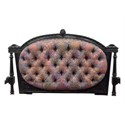 Late Victorian ebonised oak sofa, upholstered in muted purple fabric with iridescent floral pattern and nailhead trim, button-tufted backrest with carved crest rail and turned finials, scrolled padded arms supported by turned uprights, on turned supports with ceramic castors