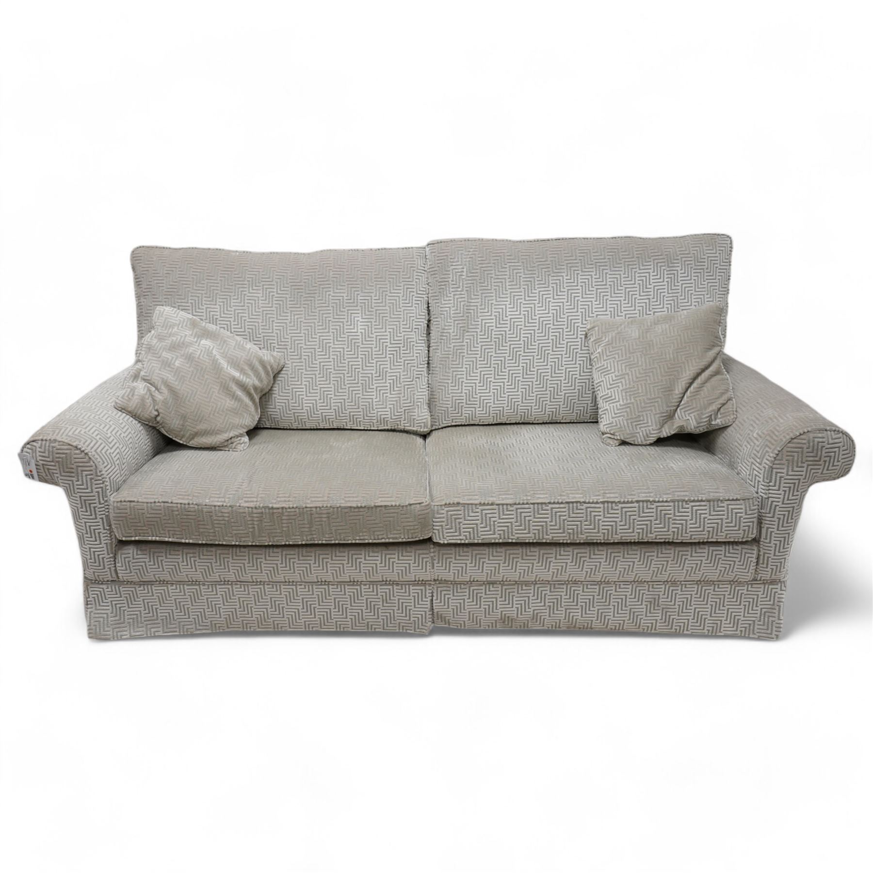 Duresta - traditional shape two seat sofa with rolled arms, upholstered in silvery-blue Greek key patterned fabric, with matching loose cushions, on castors