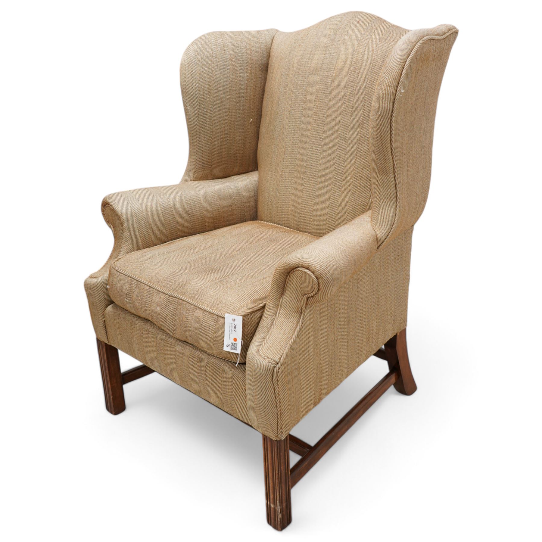 Georgian design wingback armchair, upholstered in brown herringbone fabric, on square moulded supports united by plain H-stretchers