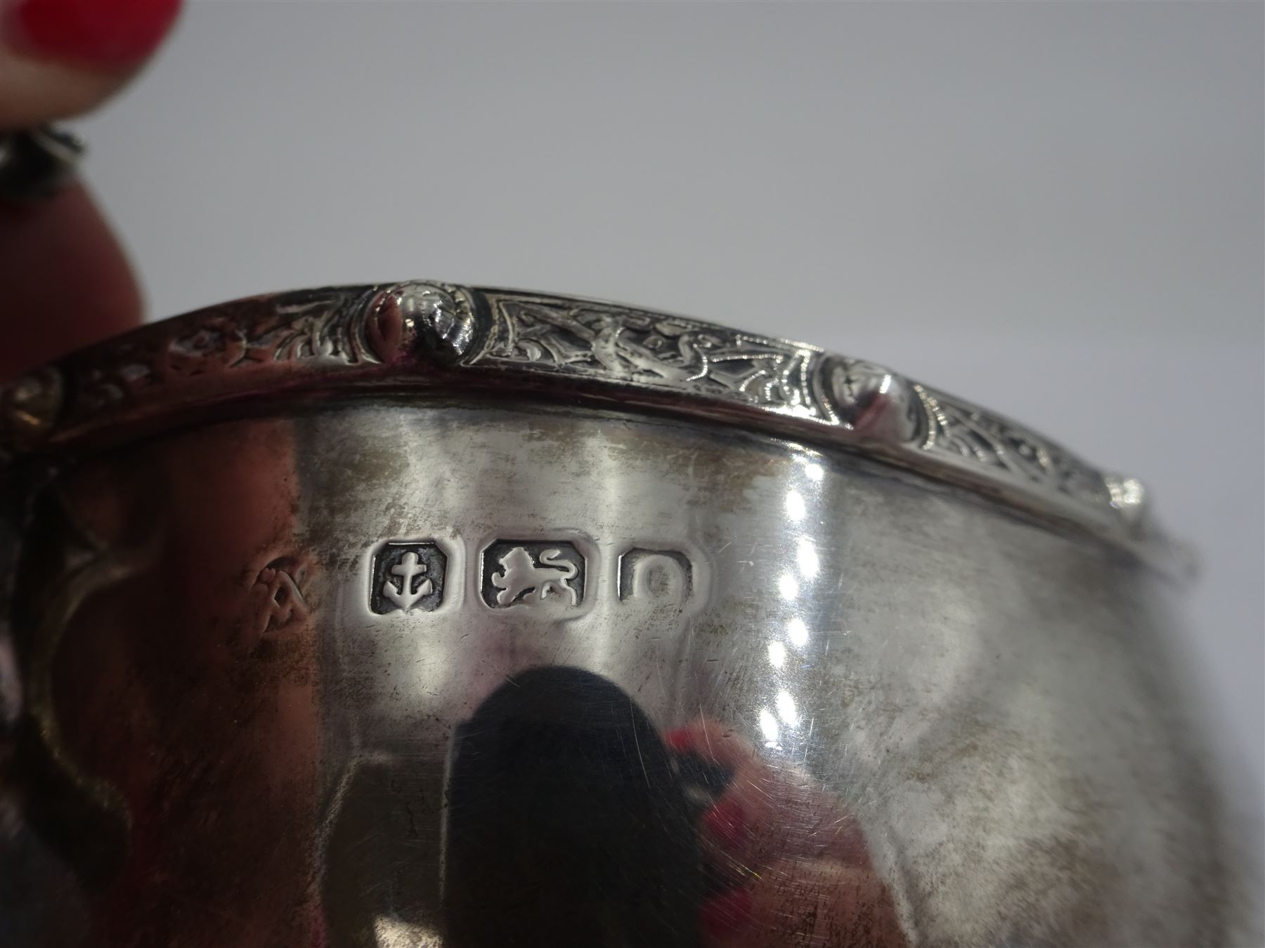 Early 20th century silver sauce boat, of typical form with flying scroll handle, the handle and feet modelled as Viking style dragon heads, hallmarked Adie Brothers Ltd, Birmingham, date mark indistinct, possibly 1940, including handle H9cm