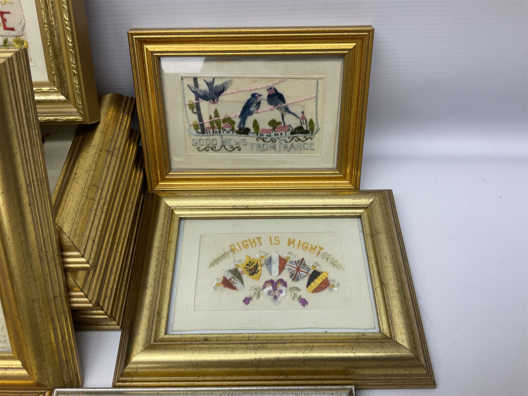 Collection of approximately thirty WWI period embroidered silk greetings cards and post cards,  mostly military examples, including 'Right is Might', 'Remember Me!', 'Greetings from your soldier boy', etc