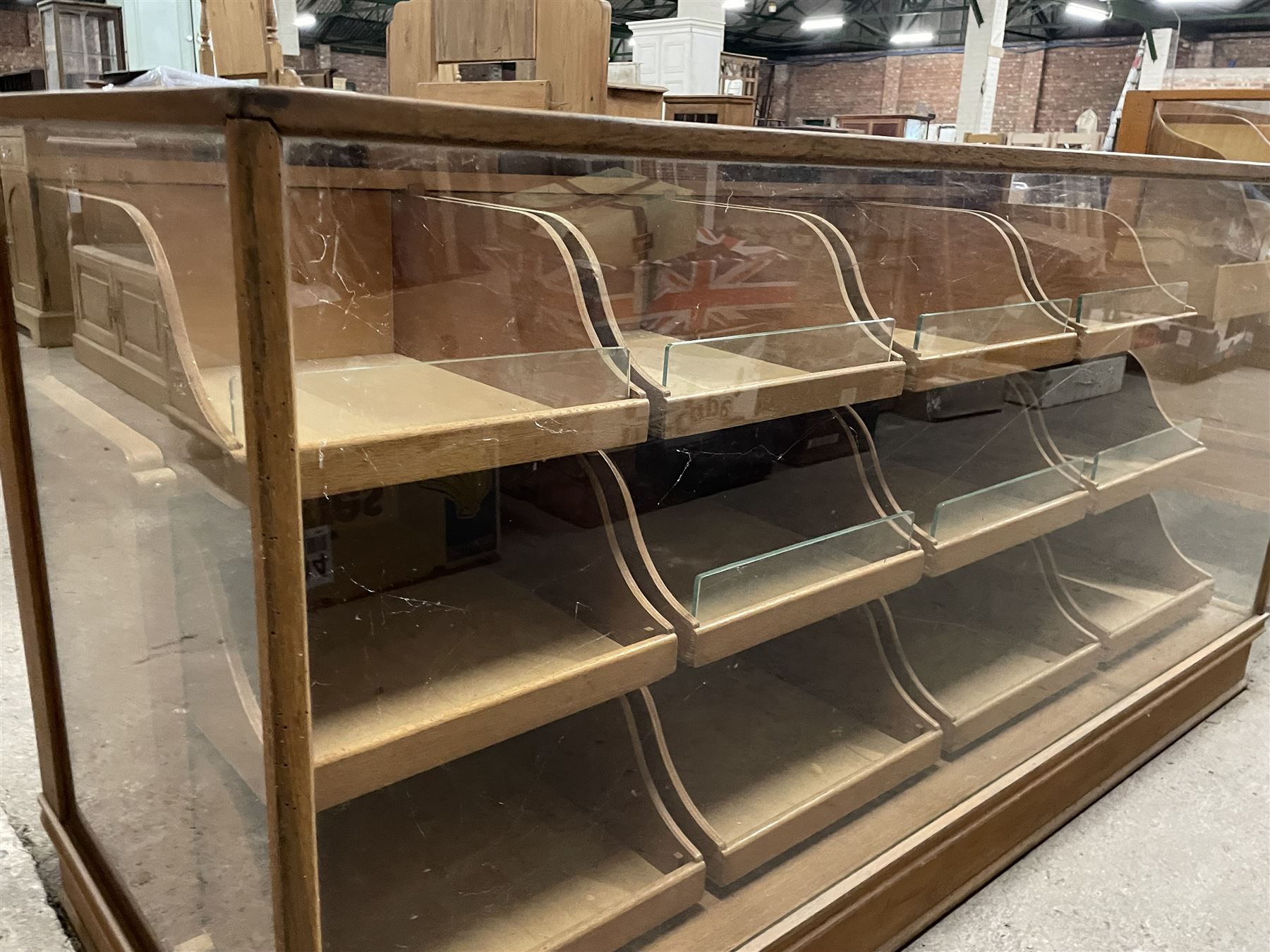 20th century oak and glazed haberdashery shop's display cabinet, fitted with twelve slides, on skirted base - THIS LOT IS TO BE COLLECTED BY APPOINTMENT FROM THE OLD BUFFER DEPOT, MELBOURNE PLACE, SOWERBY, THIRSK, YO7 1QY