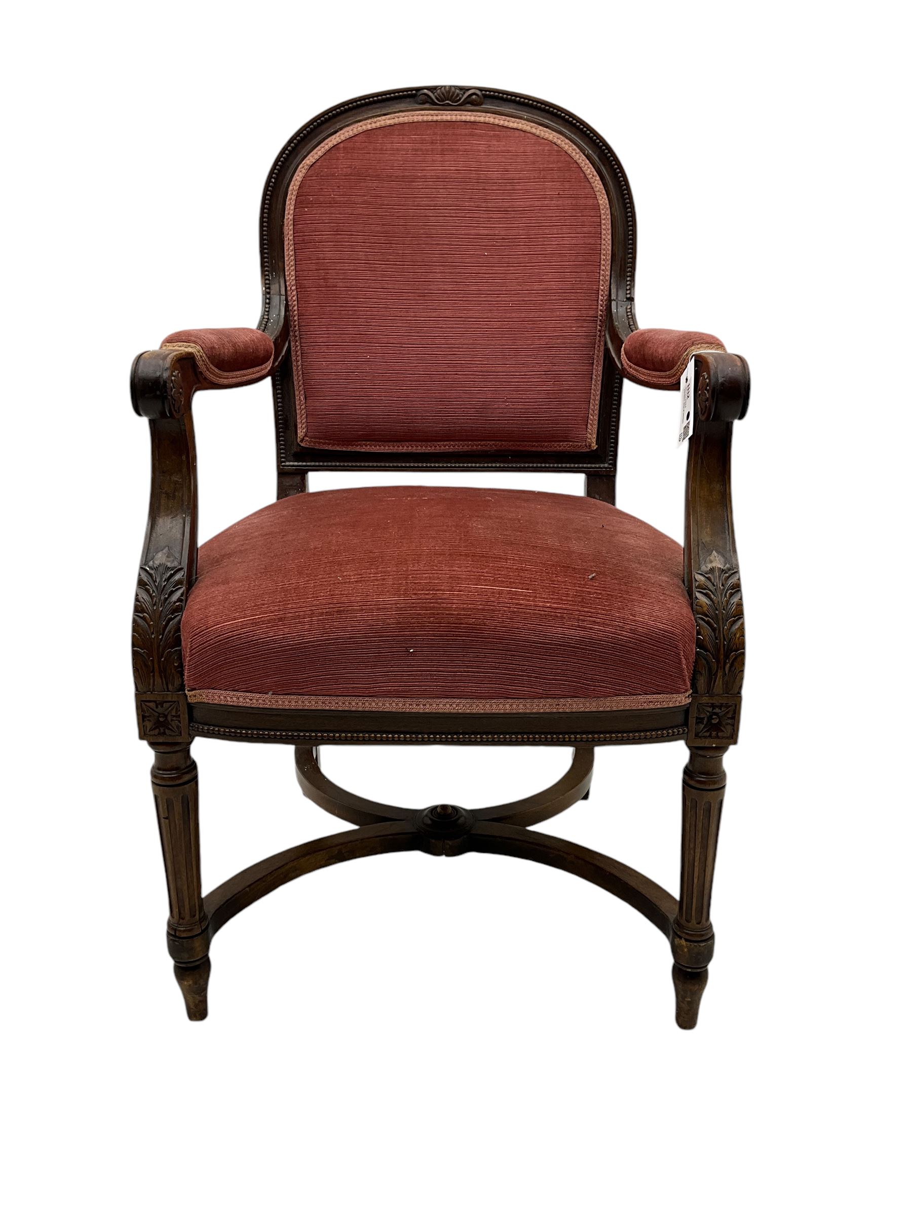 20th century French design mahogany fauteuil armchair, moulded and beaded framed, upholstered in pink fabric, rolled arms over acanthus leaf carved supports, on turned and fluted front supports united by curved X-framed stretcher 