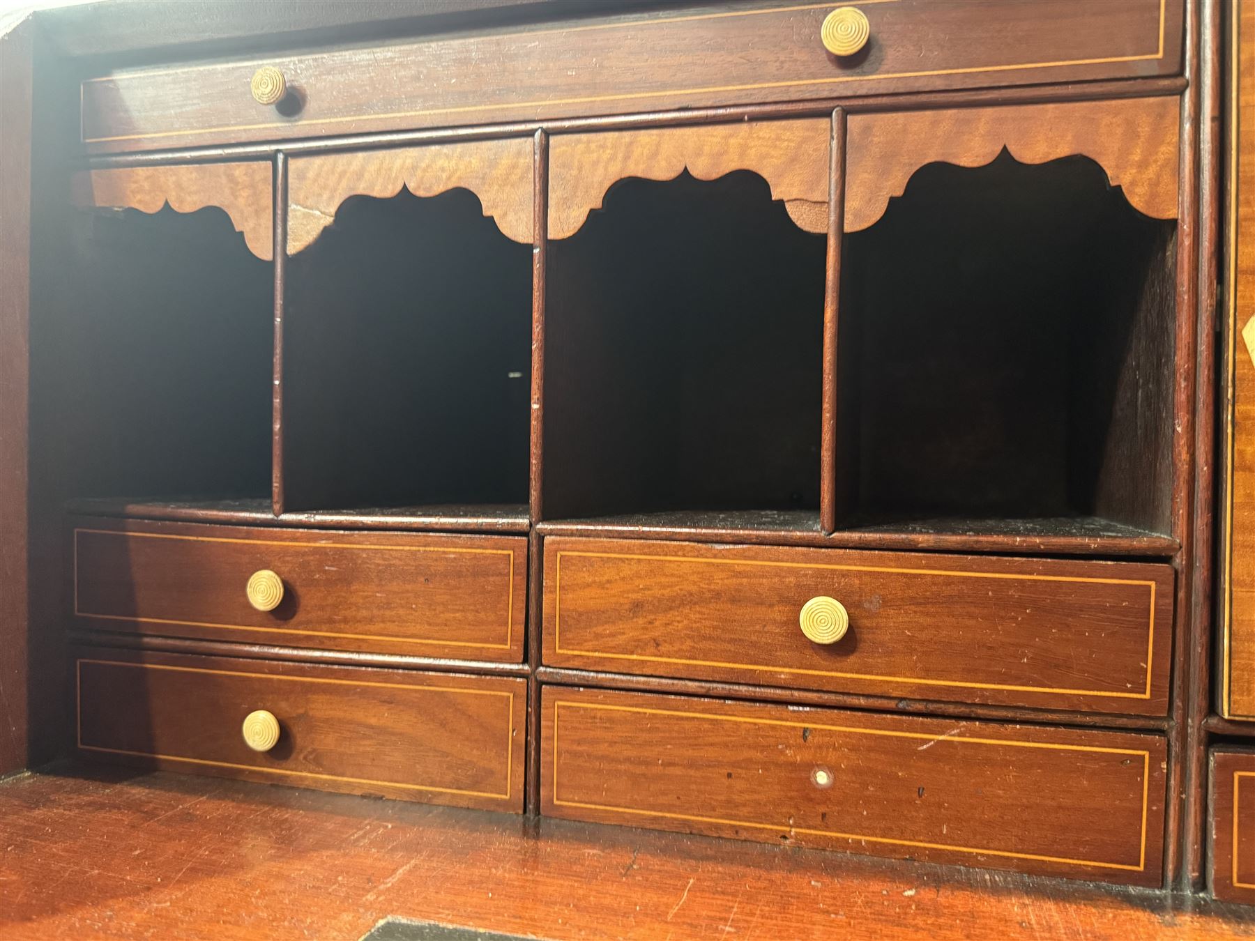 Georgian mahogany bureau, moulded fall front enclosing cupboard, small drawers, pigeonholes and inset writing surface, fitted with four long graduating cock-beaded drawers, on splayed bracket feet 