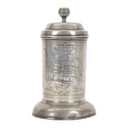 18th century Continental pewter lidded tankard, probably German, of cylindrical form, the hinged stepped cover with acorn thumbpiece above a curved handle, the body with wriggle-work decoration, upon an ovolo base, with touch marks to underside of cover, including thumb piece H22.5cm