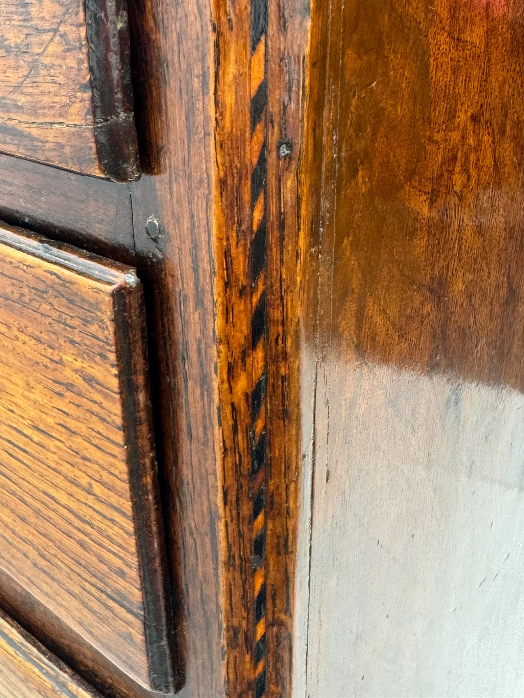 George III oak chest, rectangular top over frieze with inlaid with inscription panels 'Mary Rees' and fan motifs, frieze drawer over two short and three long graduating drawers, fitted with brass swan-neck handles and oval escutcheons, on bracket feet