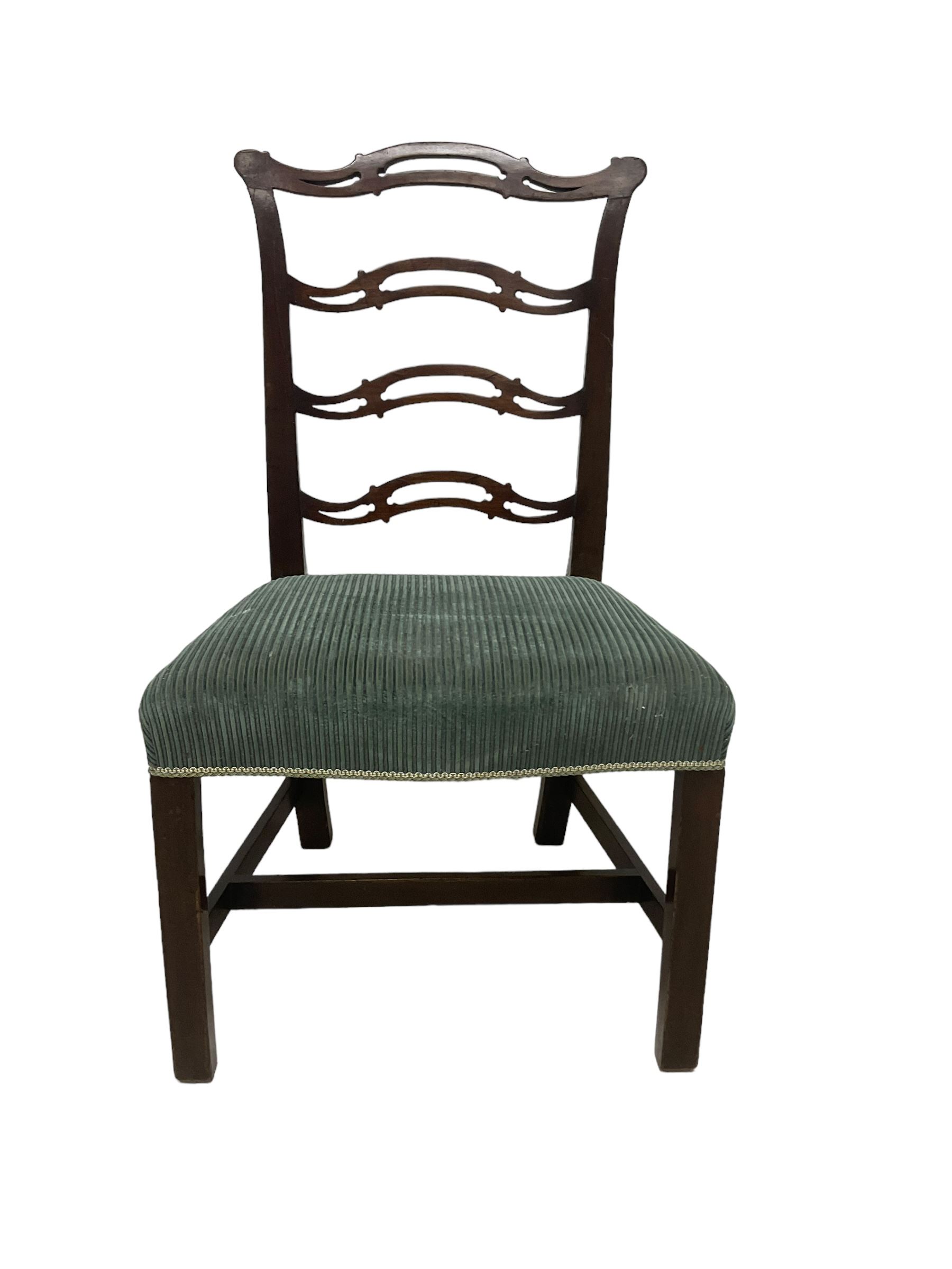 Set of twelve (10+2) Chippendale revival stained beech dining chairs, pierced waived ladder backs with over-stuffed over seats, on square moulded supports joined by stretchers