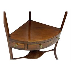 George III mahogany two-tier corner washstand, the inlaid top with geometric border, central drawer flanked by two faux drawers each with brass pull handle, on splayed supports united by shaped under-tier