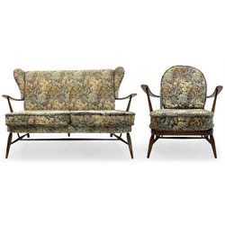 Lucian Ercolani for Ercol - mid-20th century beech and elm 'Windsor 203' two-seat sofa, wingback design upholstered in floral pattern over sprung seat and backrest, open curved arms, on splayed supports with stretchers (W133cm, D87cm, H90cm); matching easy chair (W70cm, D97cm, H82cm)