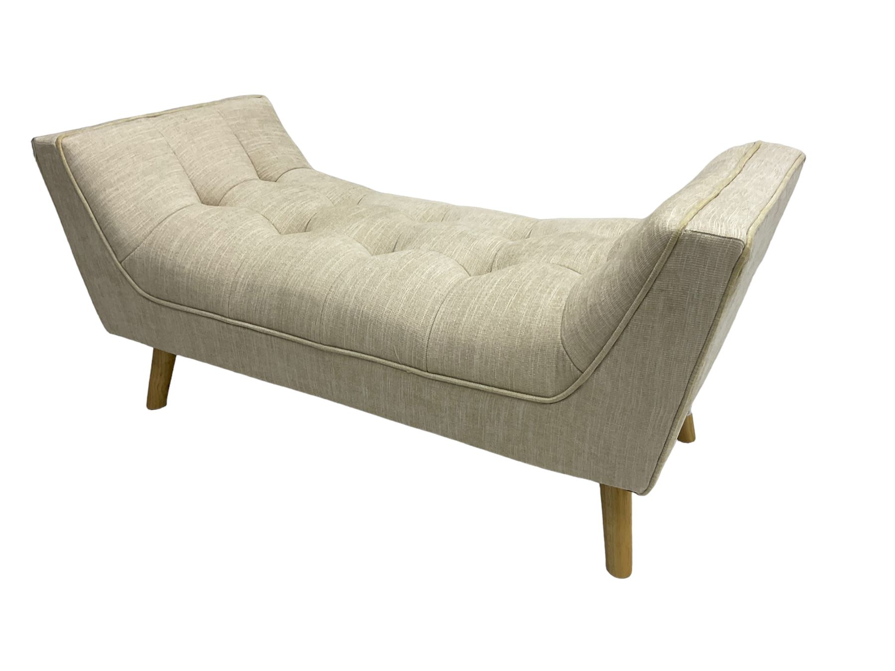 Contemporary U-shaped window or bed stool, upholstered in buttoned neutral fabric