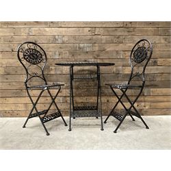 Black painted wrought metal oval bistro folding garden table, and two chairs