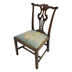 George III Chippendale design dining chair, shaped cresting rail carved with foliate scrolls over pierced and carved splat, floral needle-work upholstered drop-in seat, on square moulded supports united by H-stretchers 