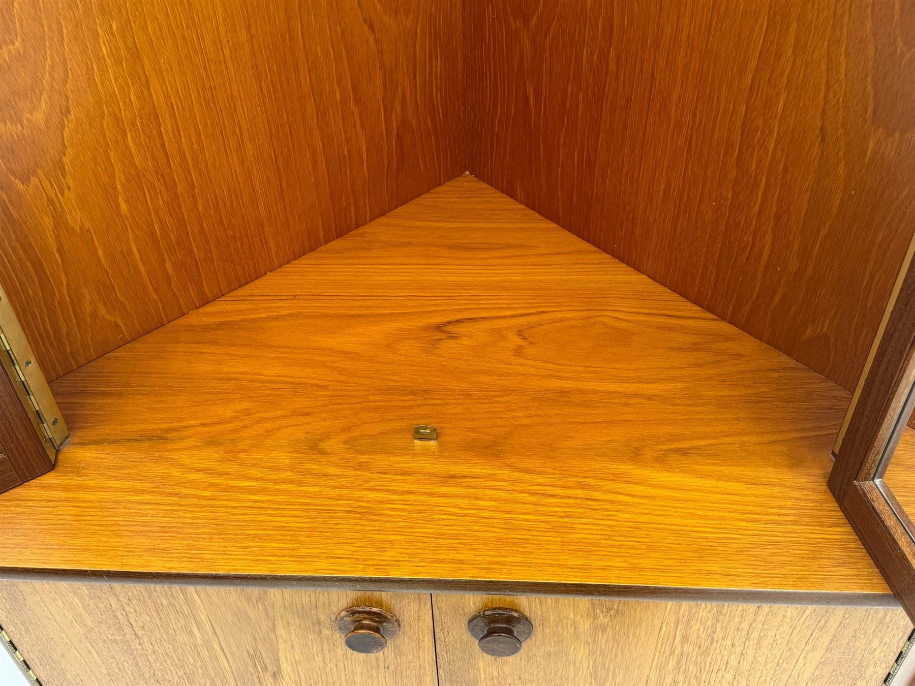 Nathan - teak corner display cabinet, double glazed doors enclosing two adjustable shelves over single cupboard.