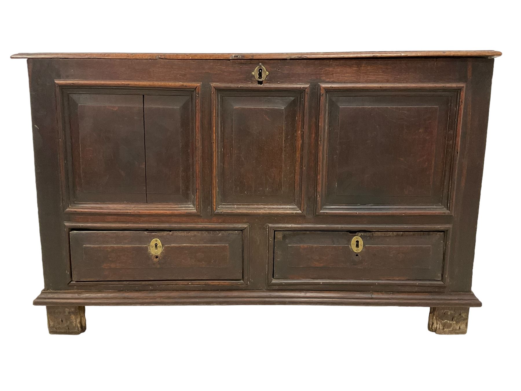 18th century oak mule chest, rectangular hinged top with moulded edge enclosing candle box, triple panelled font over two drawers with fielded panelled facias, on stile supports