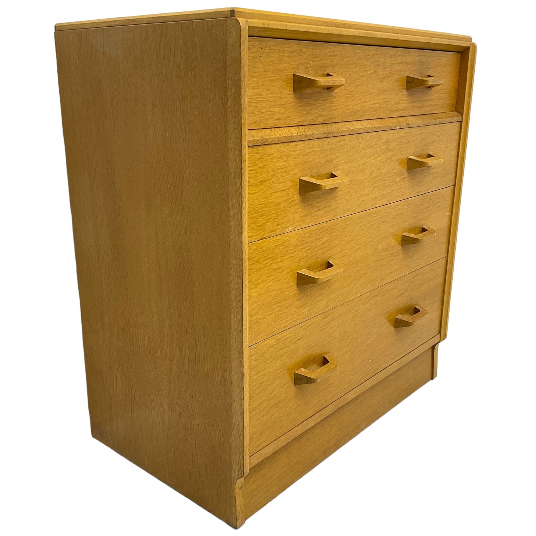 E. Gomme for G-Plan - 'Brandon' light oak chest, fitted with four long drawers, on skirted base