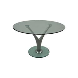 Rolf Benz glass dining table, circular bevelled glass top supported by central Y-shaped brushed metal column, terminating in circular glass base; four red leather tub chairs with curved backrests and vertical stitching, on round chrome feet (5)