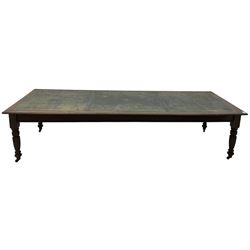 Large 10' 7'' late Victorian oak boardroom table, moulded rectangular top with inset green leather surface, on turned and reed moulded supports with brass and ceramic castors 