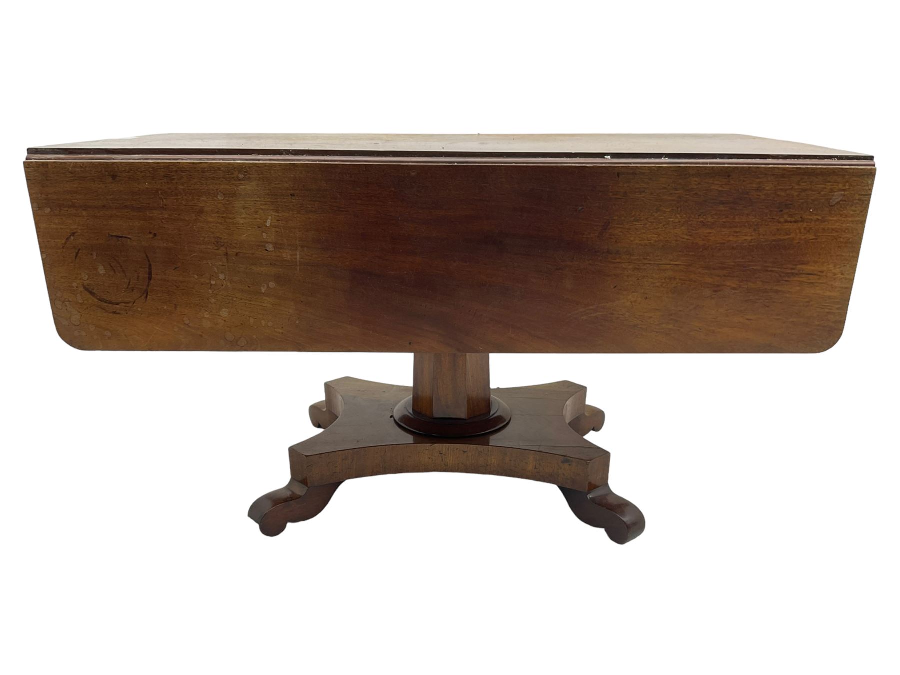 Victorian mahogany supper table, rectangular drop-leaf top with rounded corners, tapered octagonal column on concaved rectangular platform with splayed shaped feet