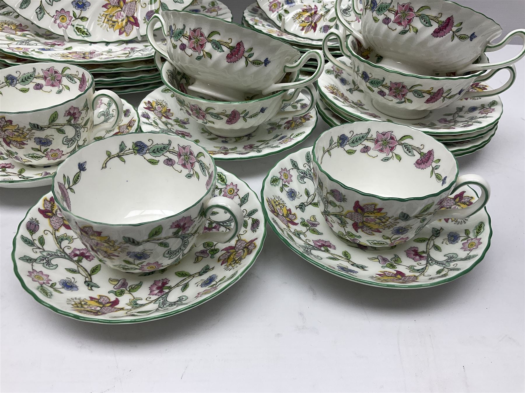 Minton Haddon Hall part tea and dinner service, including six cups and saucers, six dinner plates, six side plates, six twin handled bowls and saucers etc (44) 