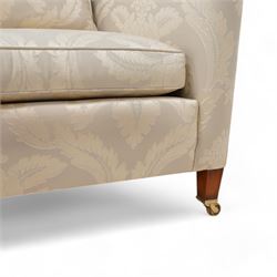 Duresta - Grande hardwood-framed three-seat sofa, upholstered in pale fabric decorated with repeating foliate pattern, on square tapering supports with brass castors 