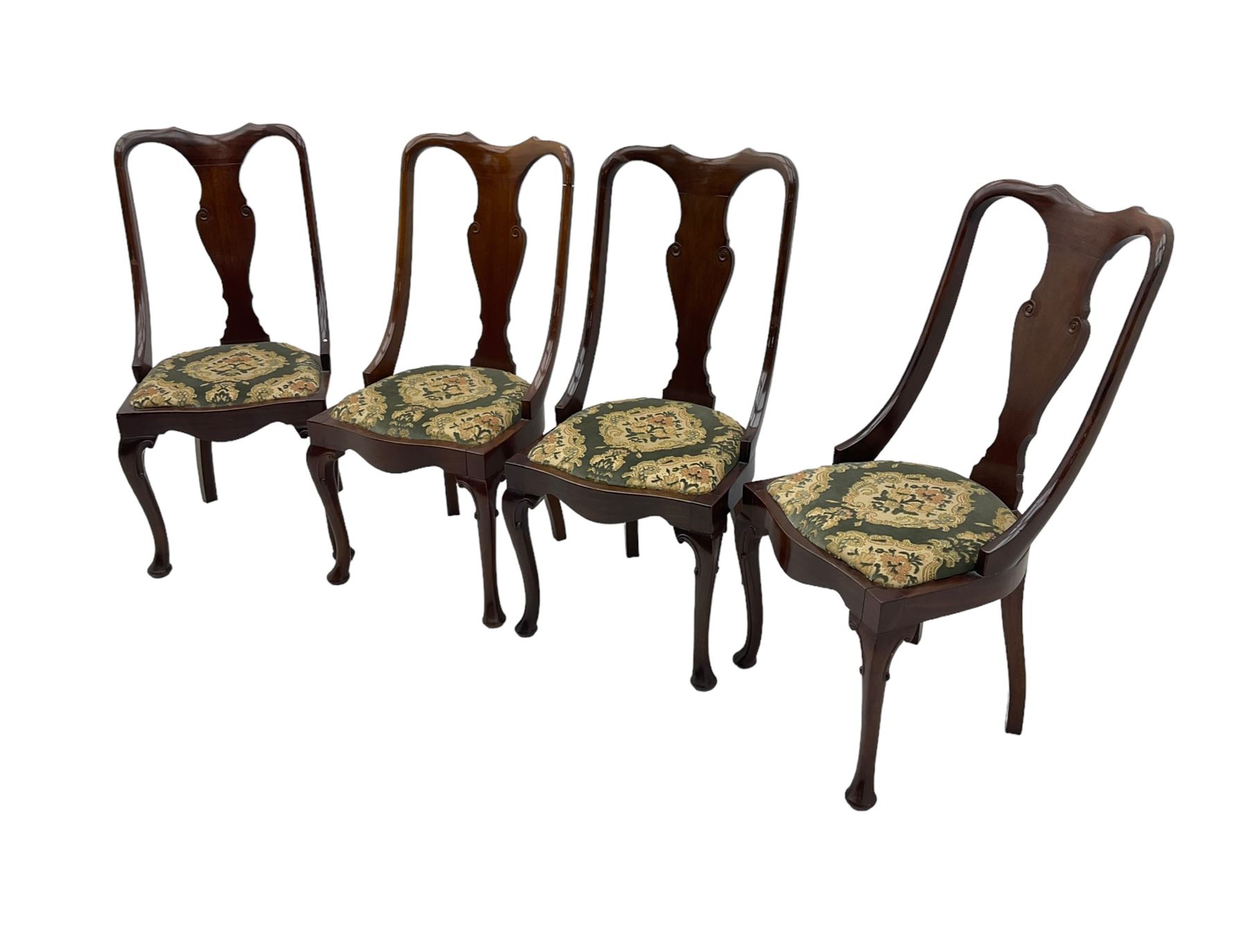 Set of eight late 19th century mahogany spoon back dining chairs, each with shaped top rail over Queen Anne design vase-shaped splat, upholstered seats in floral patterned fabric, raised on cabriole supports with scroll carved knees