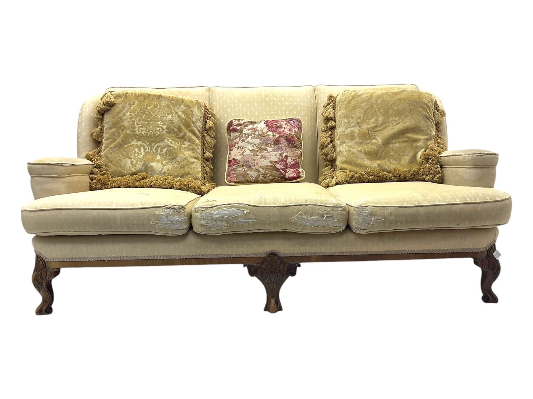 Late 20th century mahogany framed three seat sofa, upholstered in cream fabric with repeating cross pattern, raised on cabriole supports (W192cm, D98cm, H89cm); matching armchair in light pink fabric (W92cm, D98cm, H89cm) 