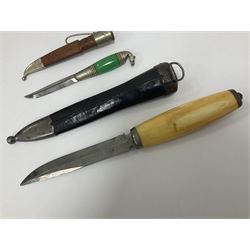 Two Scandinavian bowie knives, the first example with polished green handle with horse head final in white metal, with brown leather sheath, blade L6cm overall L12cm, the second with a polished bone handle, in black sheath with white metal tip, blade L11cm overall 23cm