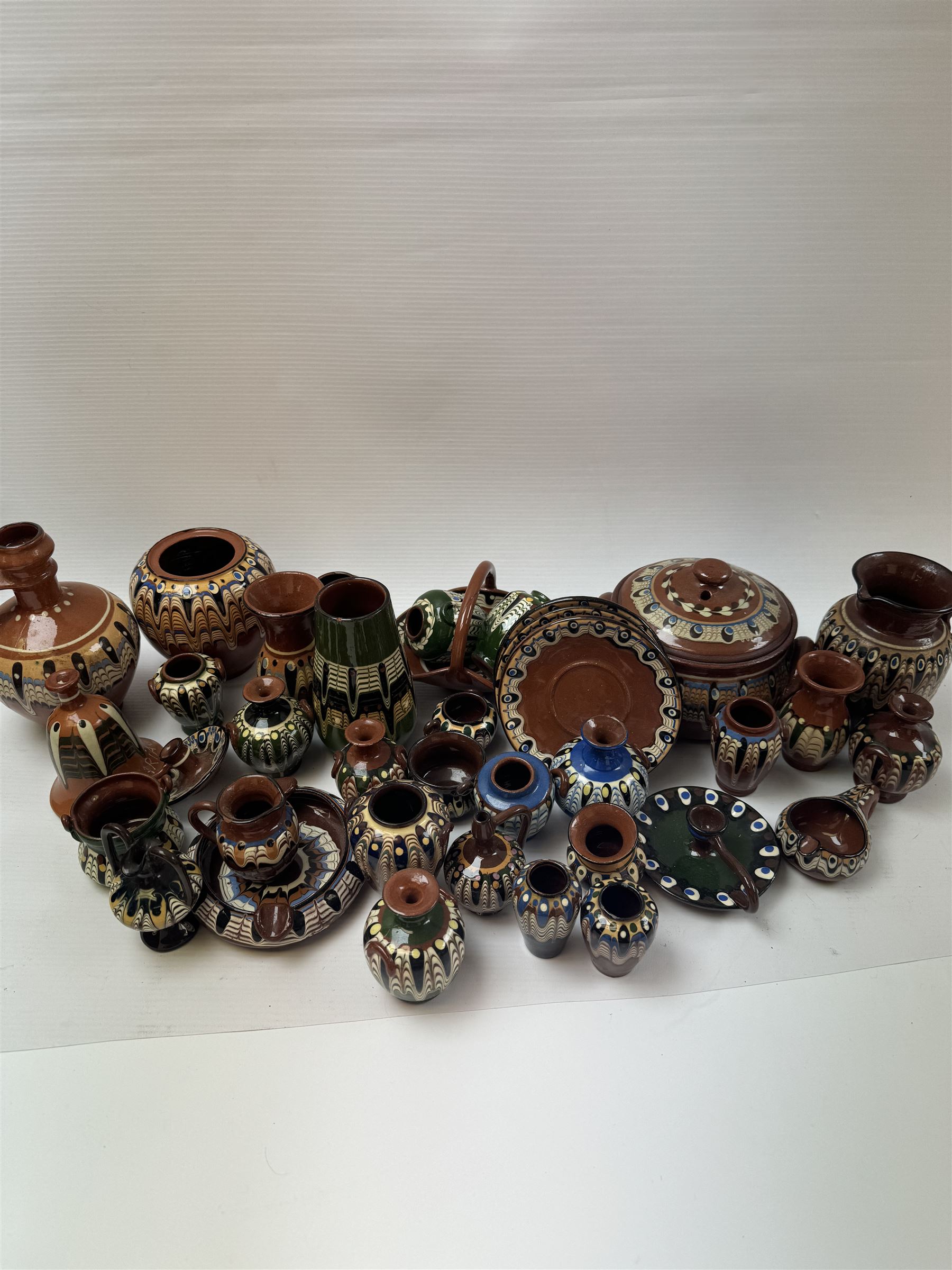 Collection of slipware, including miniature vases, baskets, candlesticks jugs etc 