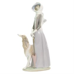 Large Lladro figure of a lady with a Borzoi and holding a parasol H39cm