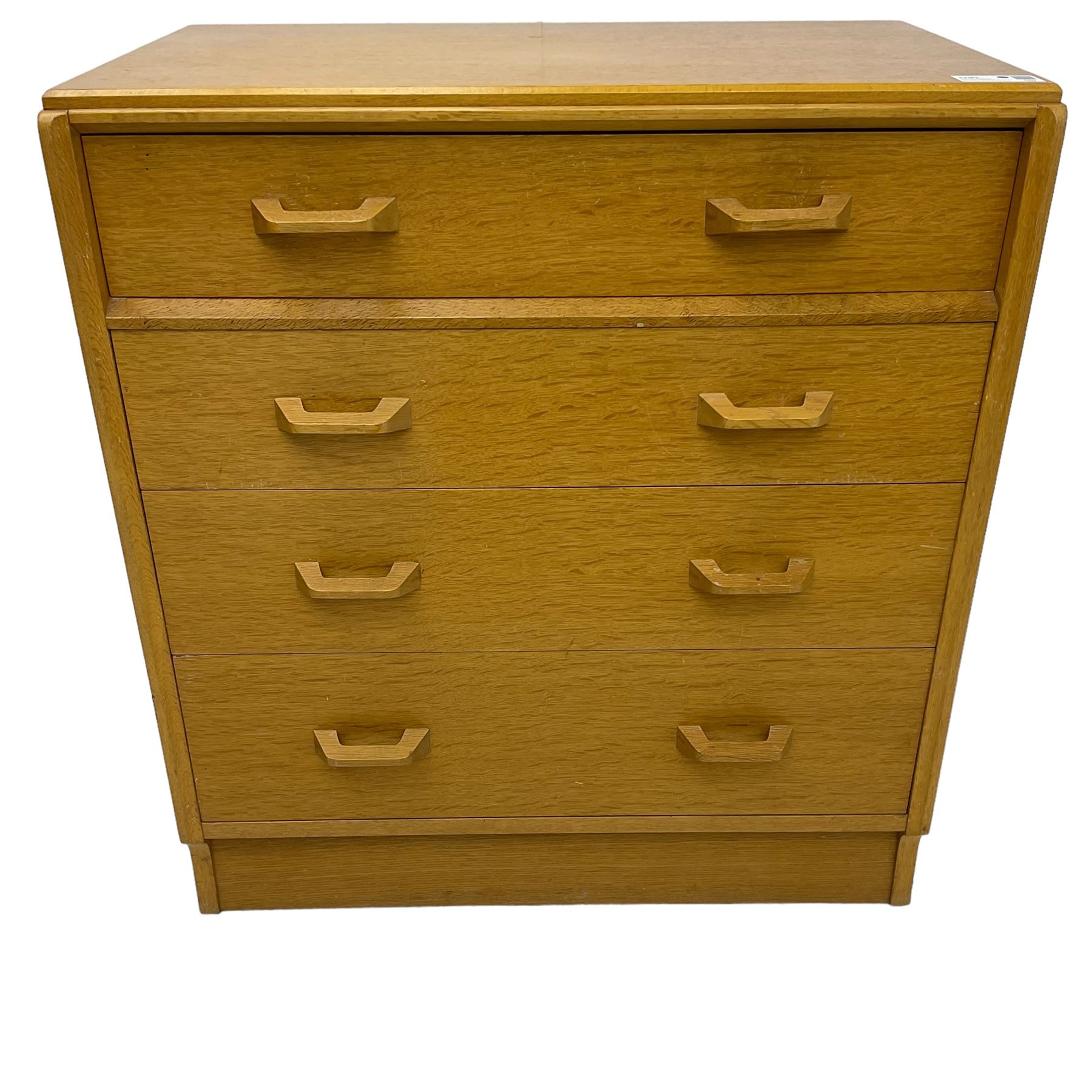 E. Gomme for G-Plan - 'Brandon' light oak chest, fitted with four long drawers, on skirted base