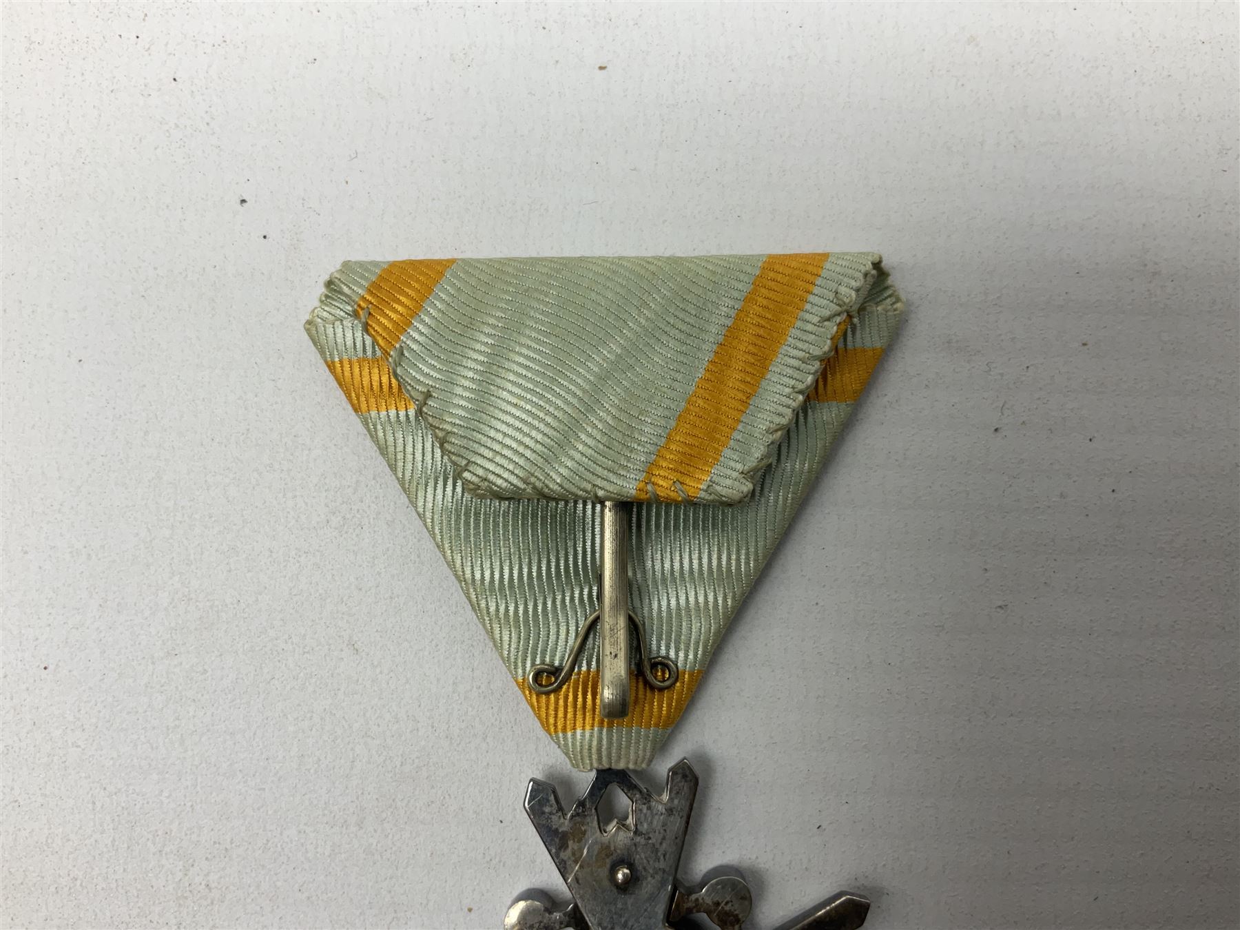 Two Japanese silver medals - Order of the Golden Kite 7th Class; and Order of the Sacred Treasure 6th Class with pin badge; each in a lacquered box with characters to the lid (2)