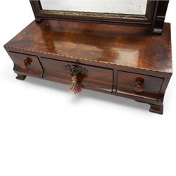 George III mahogany upright swing toilet mirror, with brass finials, bevelled plate and gilt slip, the base with three drawers and on bracket feet W39cm