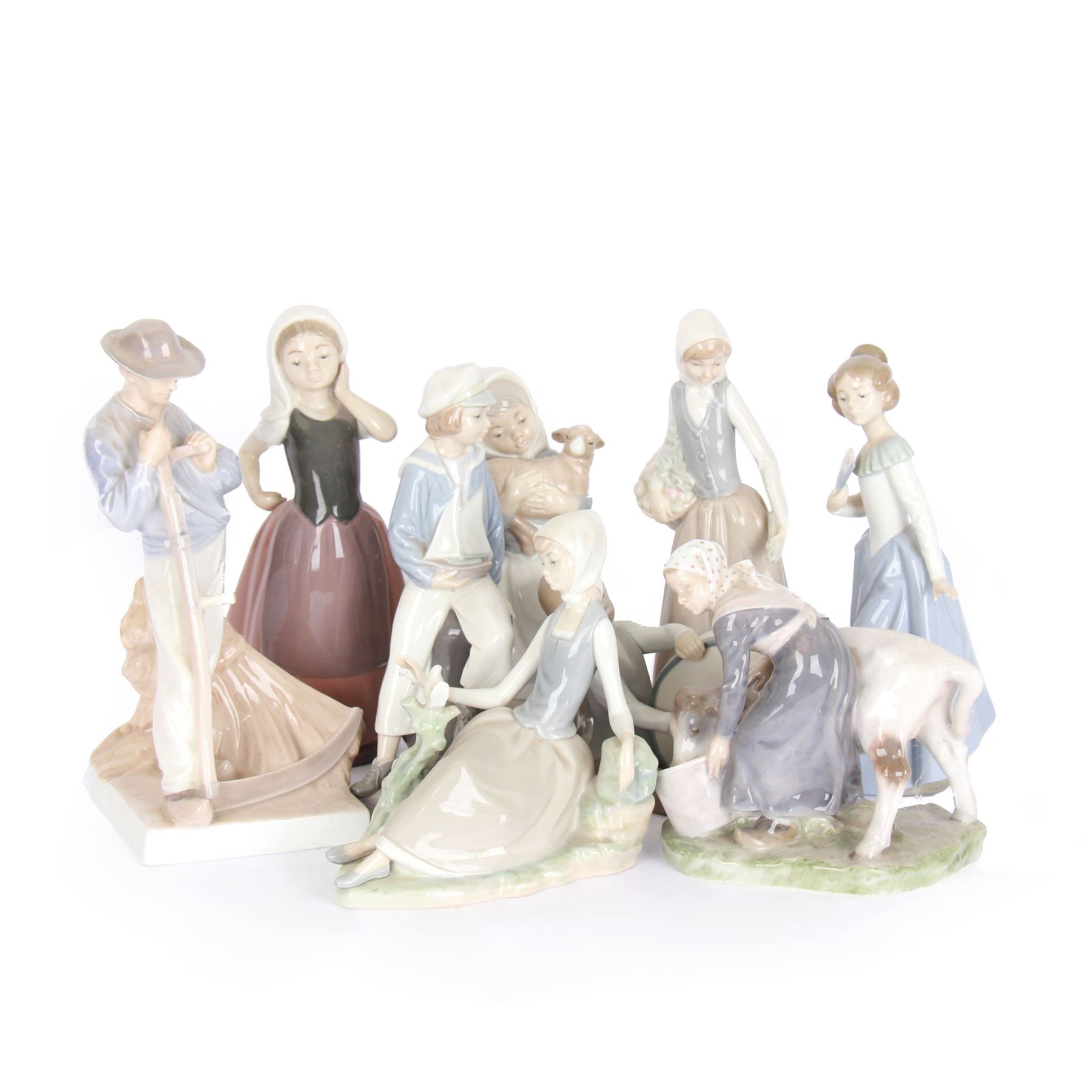 Two Royal Copenhagen figures, comprising girl with cow, 779 and Farmer with scythe, no 685 , together with two Lladro figures, and similar 