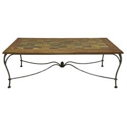 Mid-20th century coffee table, rectangular tiled wooden top framed by bamboo detailing, supported by wrought iron base with scrolled legs and central mosaic accent