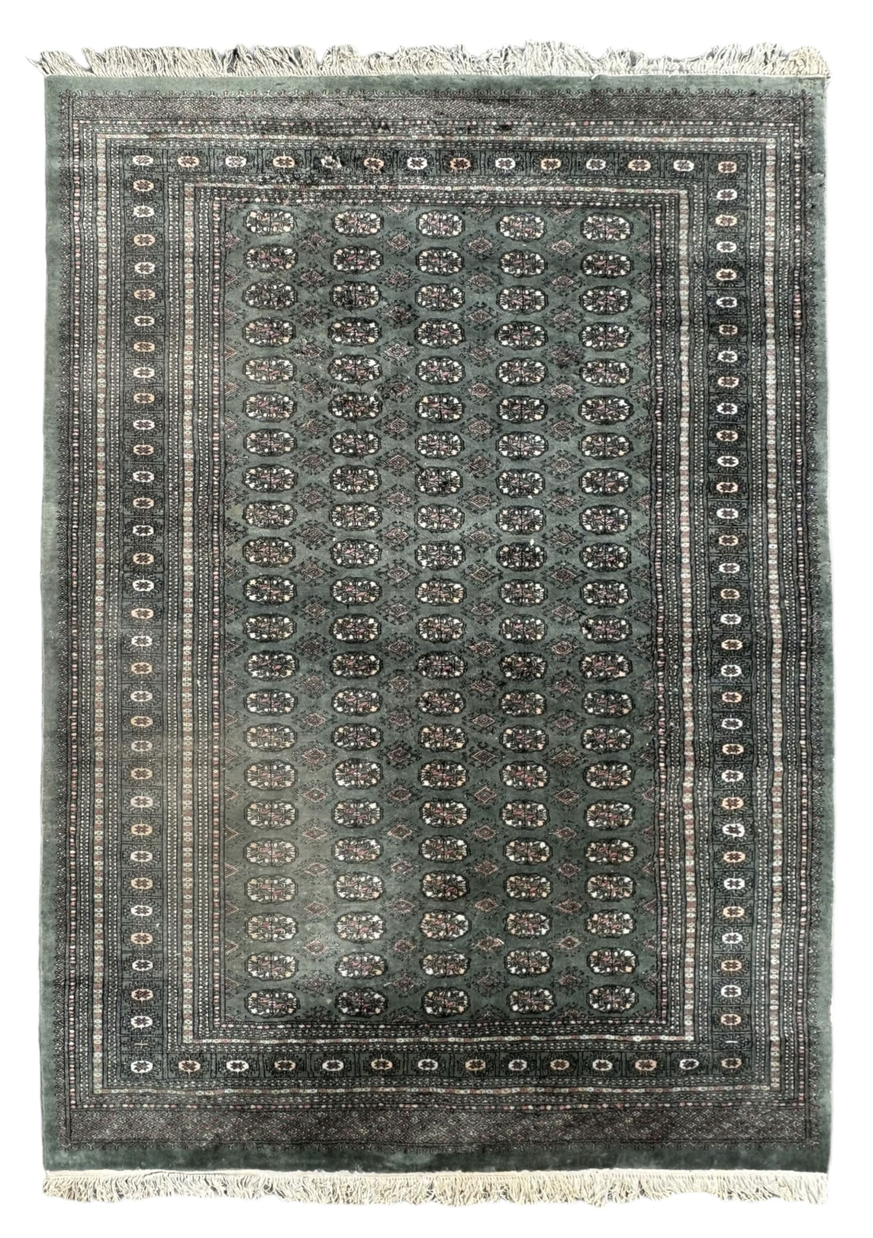 Pakistani Bokhara green ground rug, the field decorated with rows of repeating gul motifs, the main border featuring a series of smaller gul designs and geometric patterns, framed by multiple guard stripes