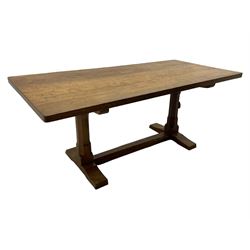 Rabbitman - oak dining table, rectangular adzed top, twin octagonal pillar supports on sledge feet, united by floor stretcher, carved with rabbit signature, by Peter Heap of Wetwang 