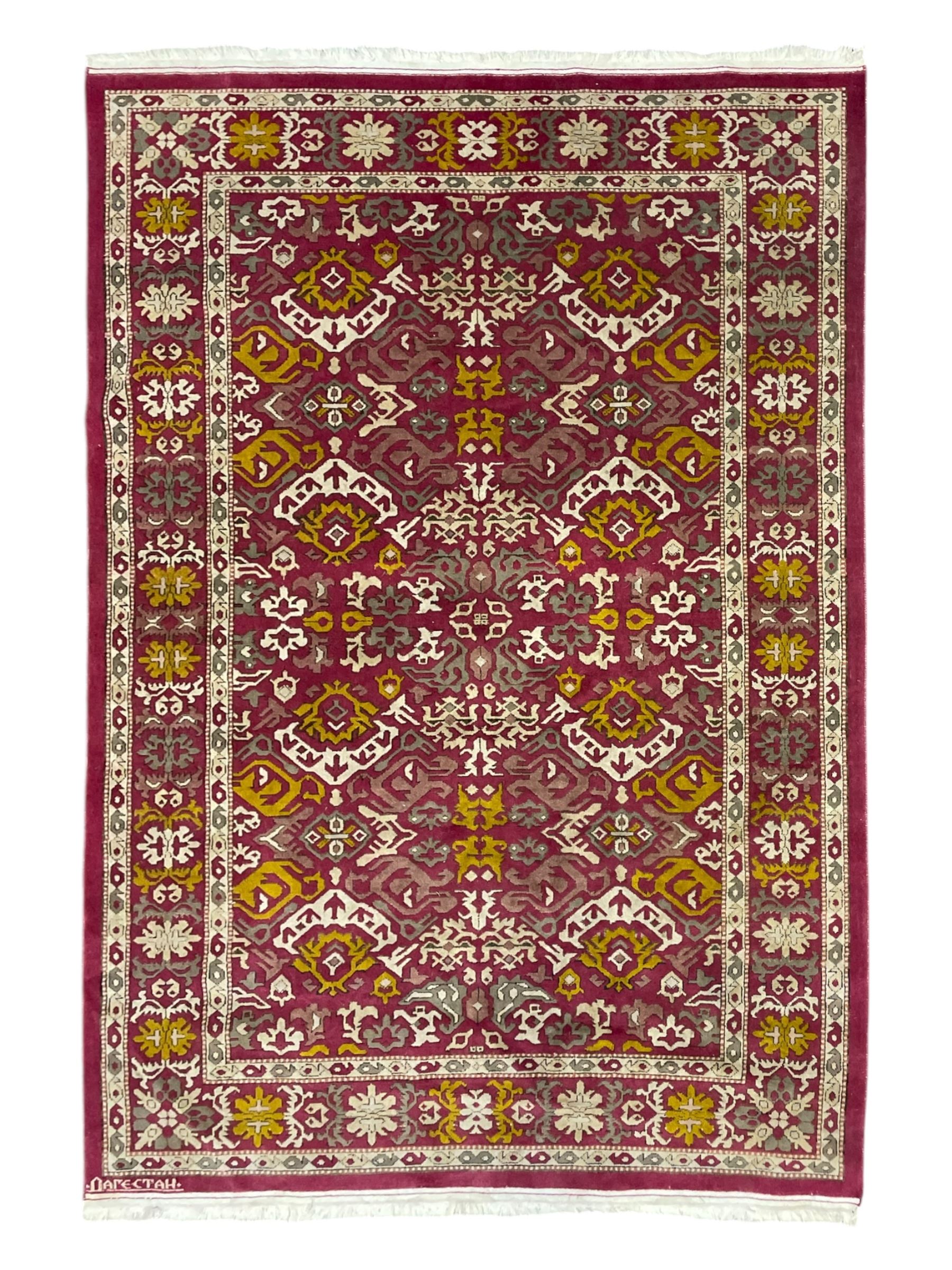 Persian design red ground rug, decorated with stylised plant motifs, repeating border within Boteh decorated guard stripes 